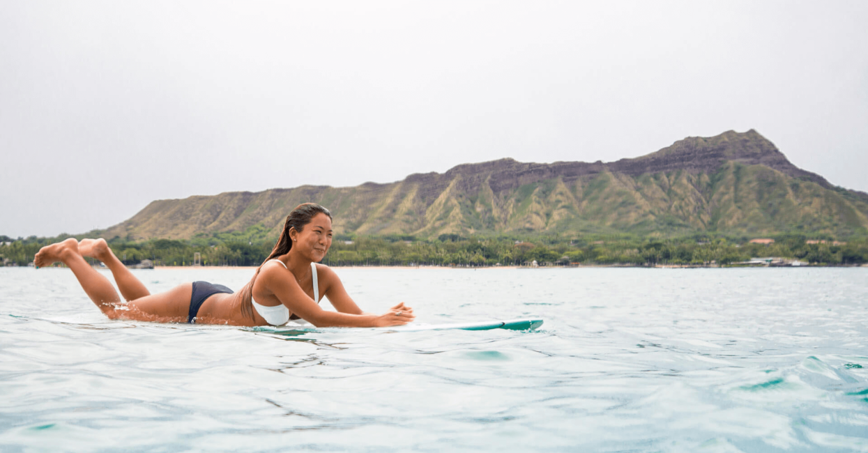 Surfer in front of Diamondhead